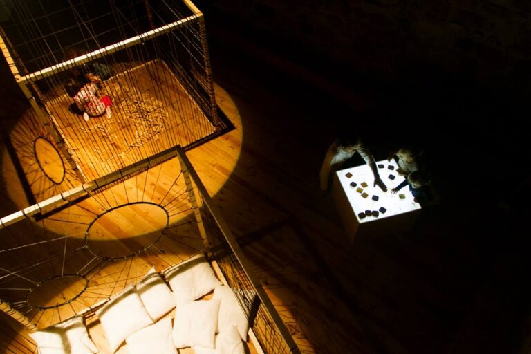 Createctura installation at La Redonda, with suspended structures and a light table